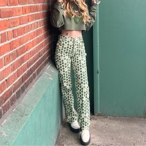 Green and off-white graphic corduroy jeans